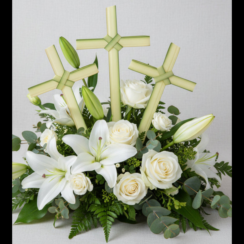 Cross-shaped green palm leaves on a floral arrangement