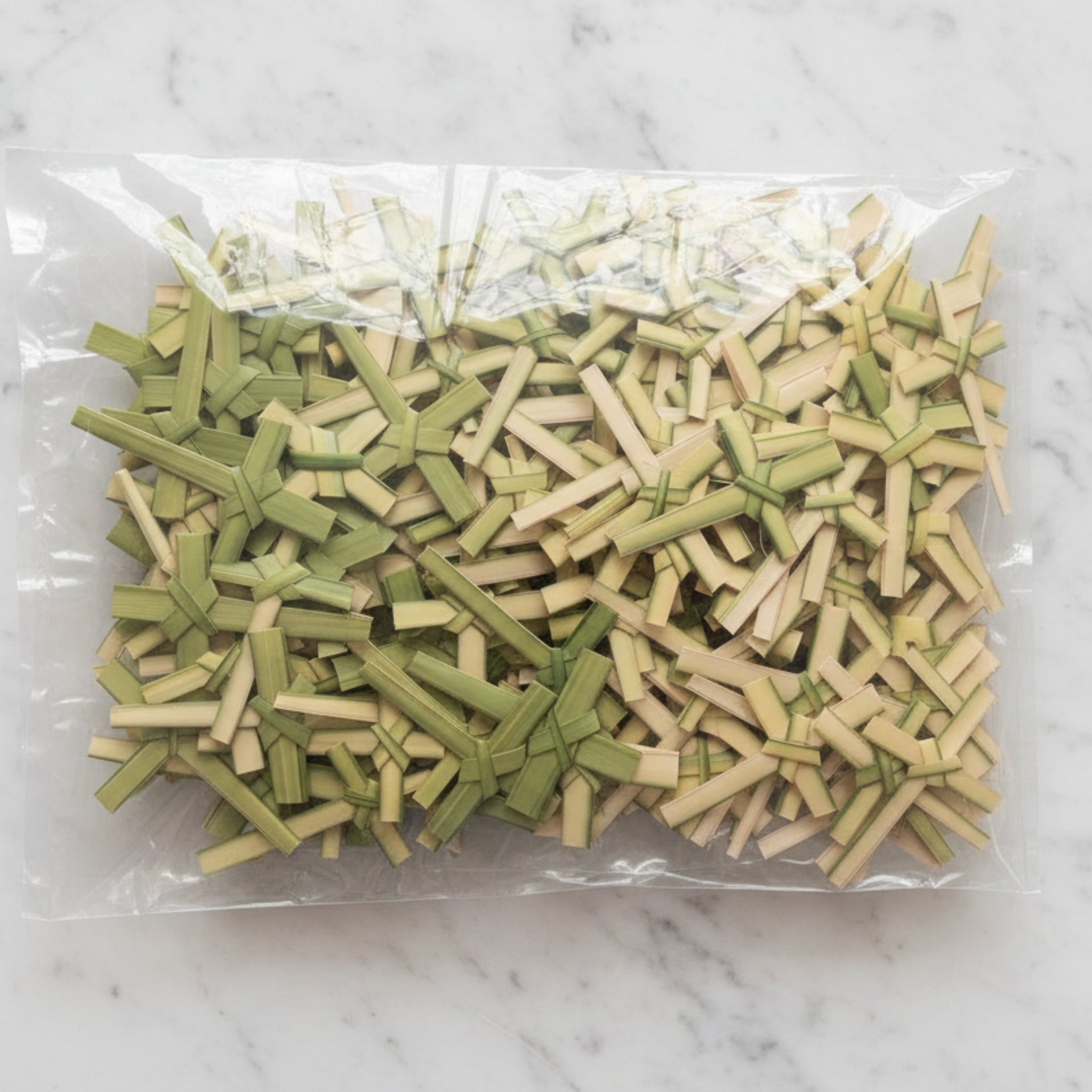 yellow paper crosses in a clear poly bag