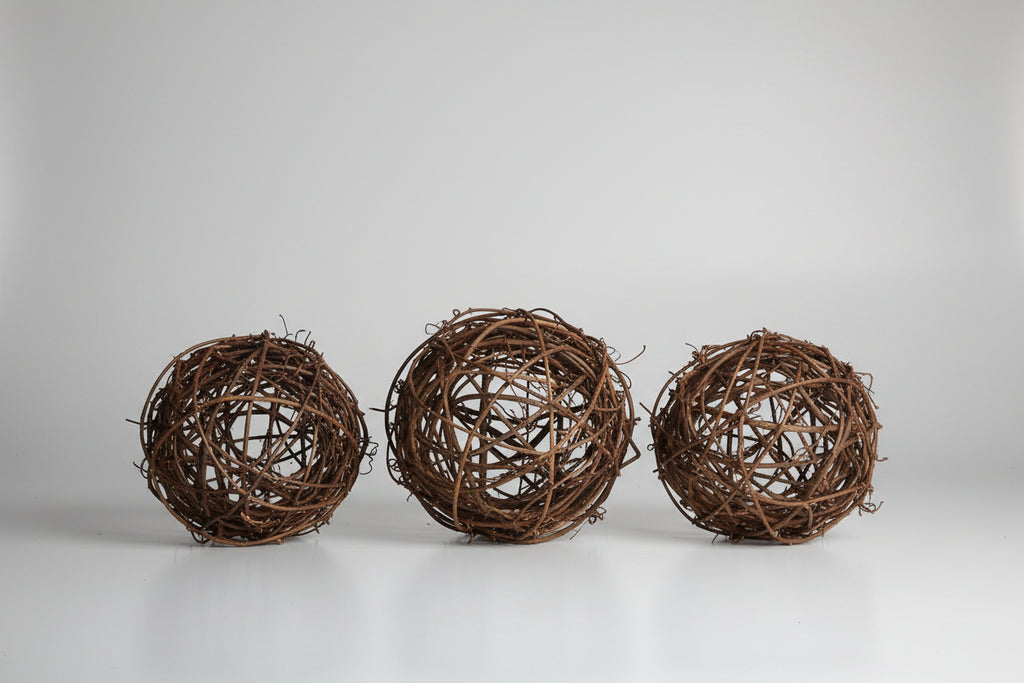 wooden sticks weaved into balls