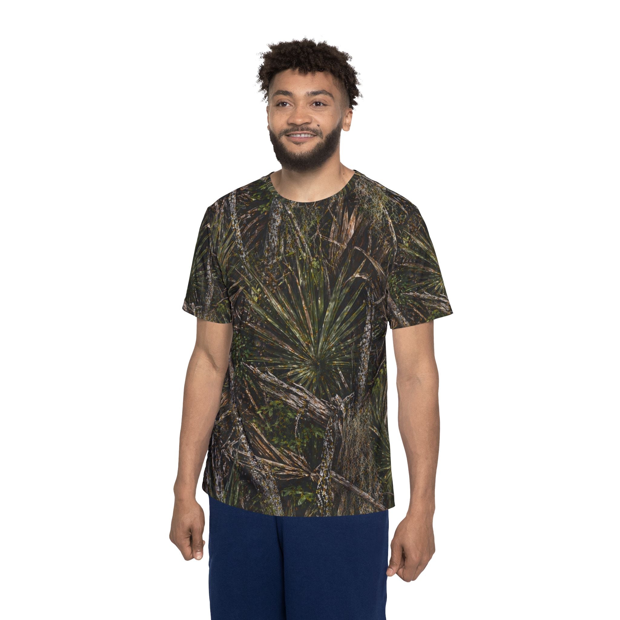 Man wearing a camouflage t-shirt on a white background
